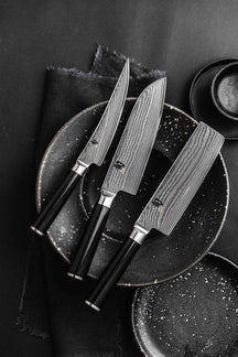 Cuchillo de carnicero Kai Shun Classic - acero damasco de 32 capas - 18 cm - DM-0712